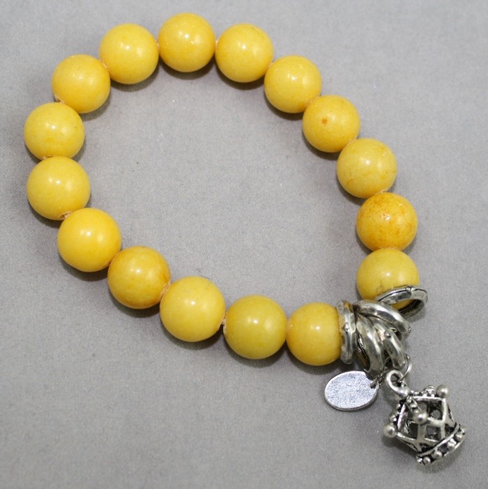 Yellow gemstone bracelet with crown