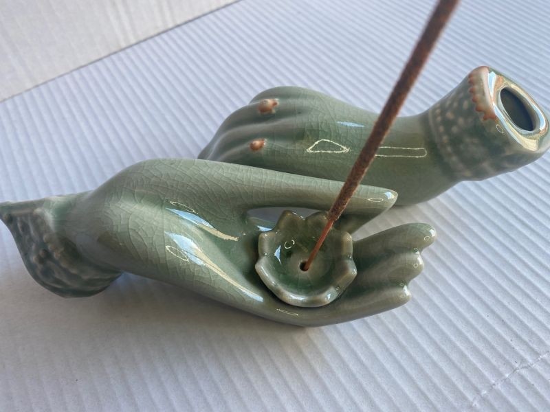 Ceramic lotus on hand Incense Holder