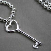 Silver beads with key